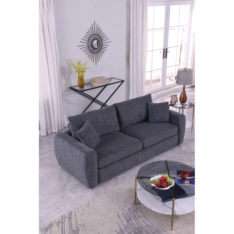 Close-up of the charcoal upholstery texture on the Aria sofa