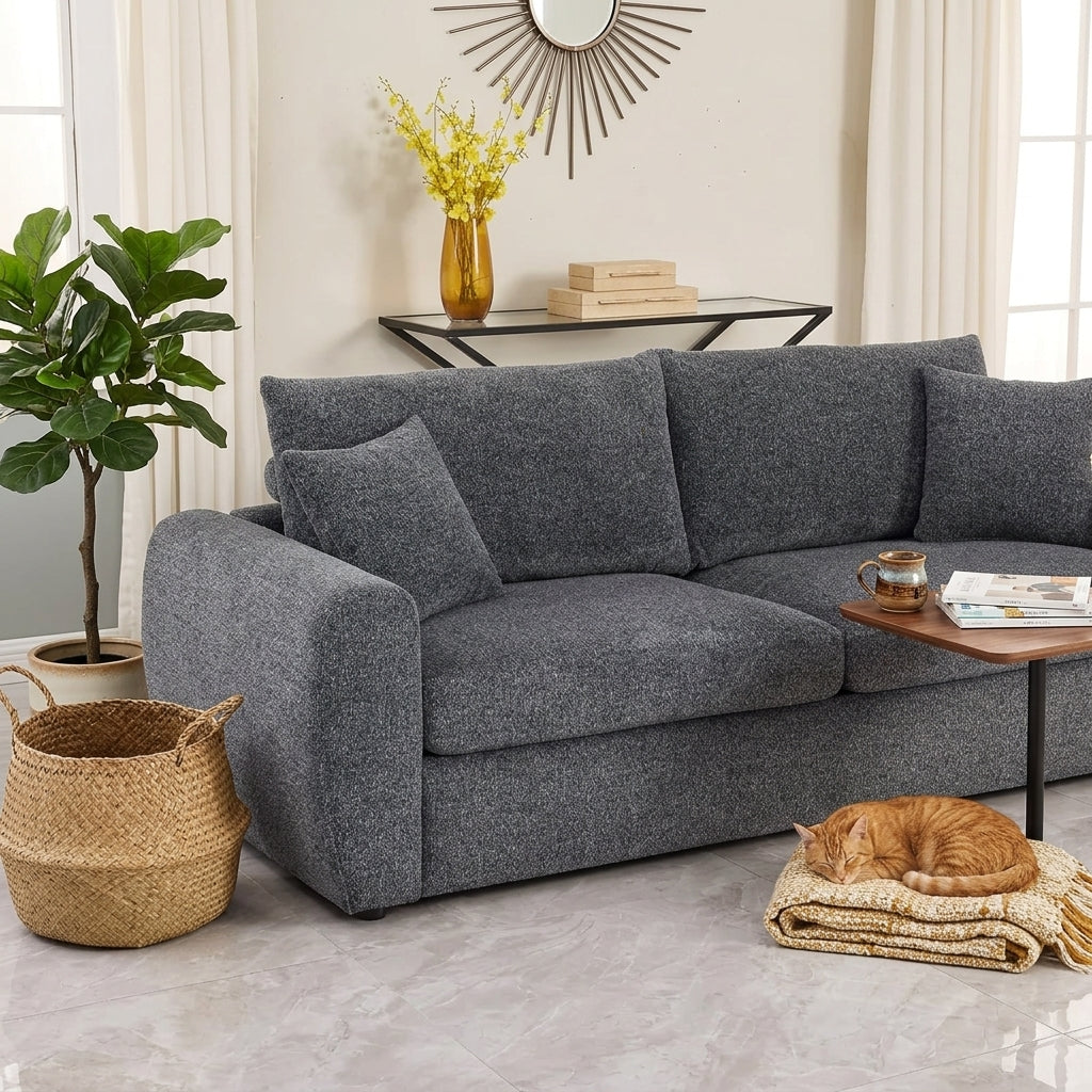 Aria modern sofa in charcoal fabric, styled in a bright living room
